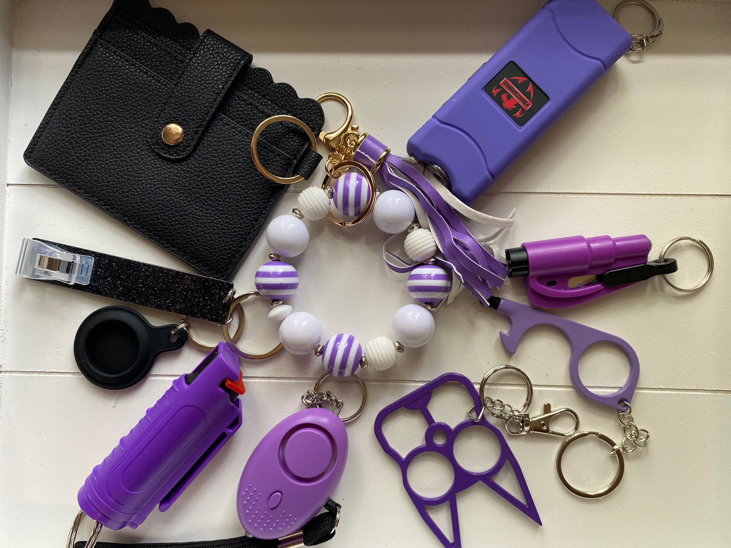 10 piece purple and white keychain set