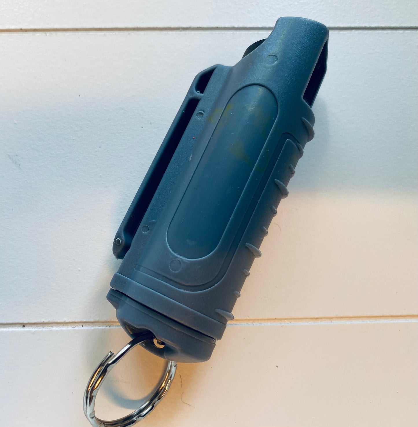 Gray pepper spray in plastic case