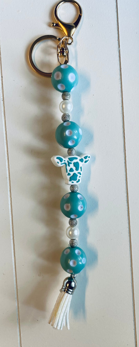 Teal and white cow head keychain