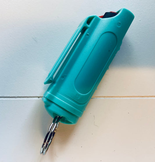 Teal pepper spray in plastic case