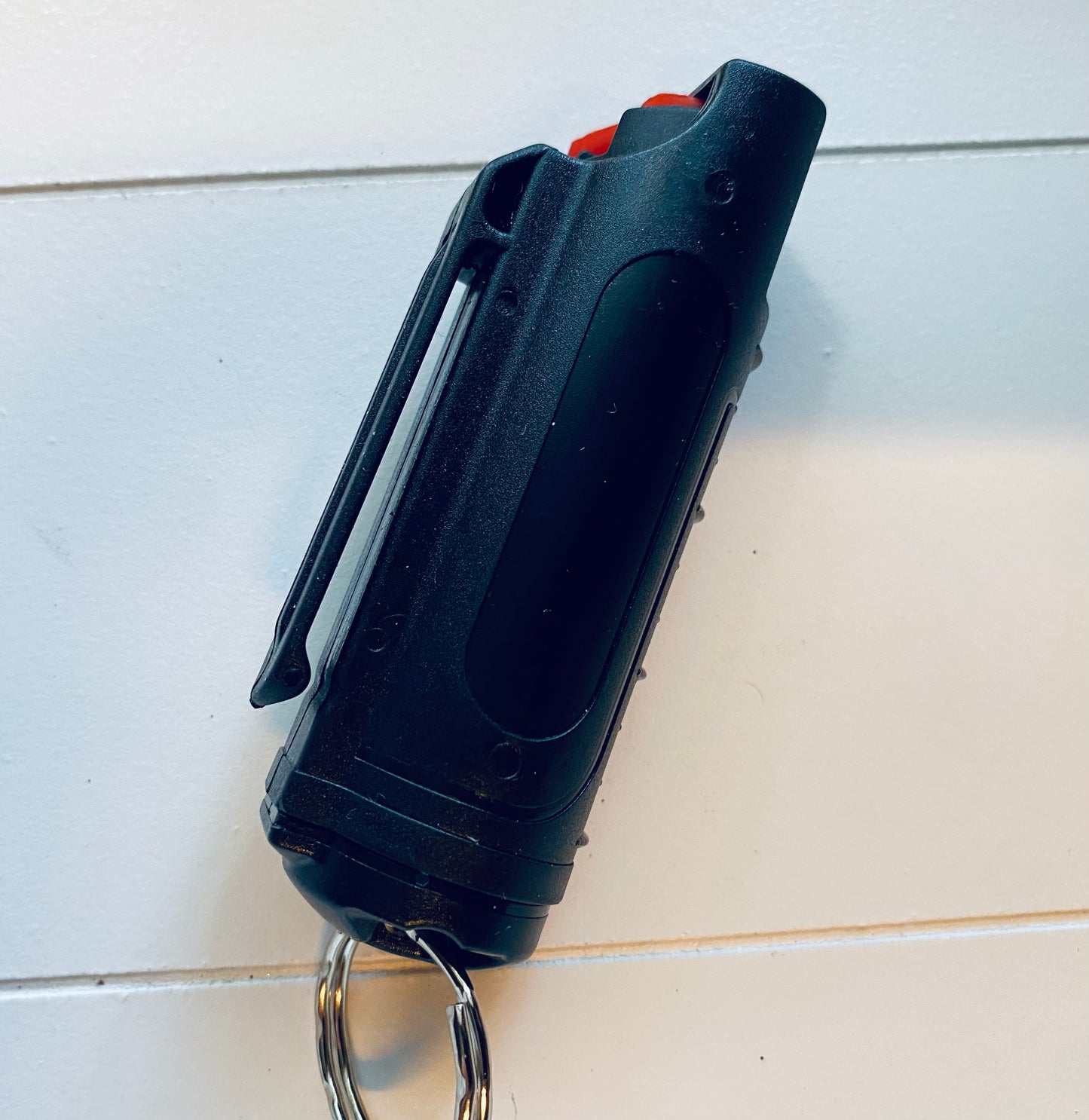 Black pepper spray in a plastic case